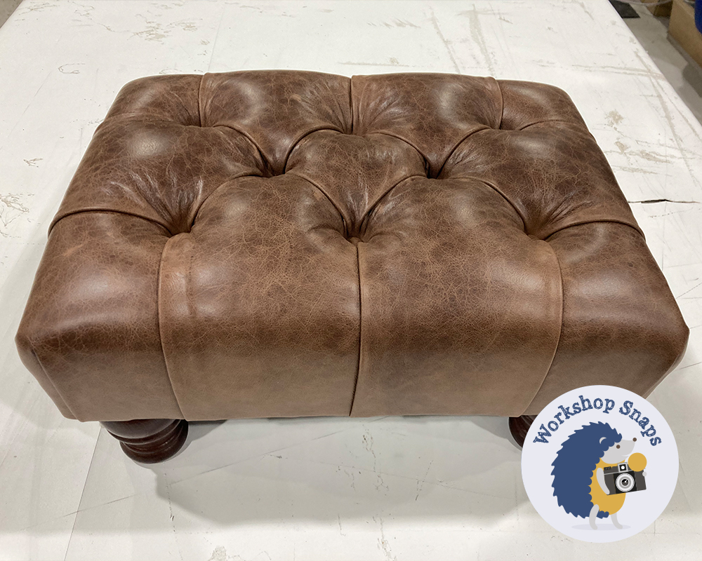 Very small rectangle padded footstool in dark brown leather with buttons