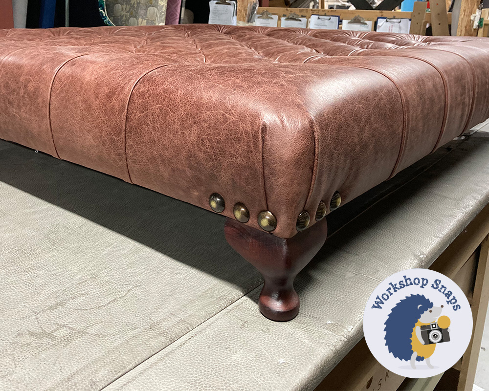 large square oxblood leather fabric footstool with buttons