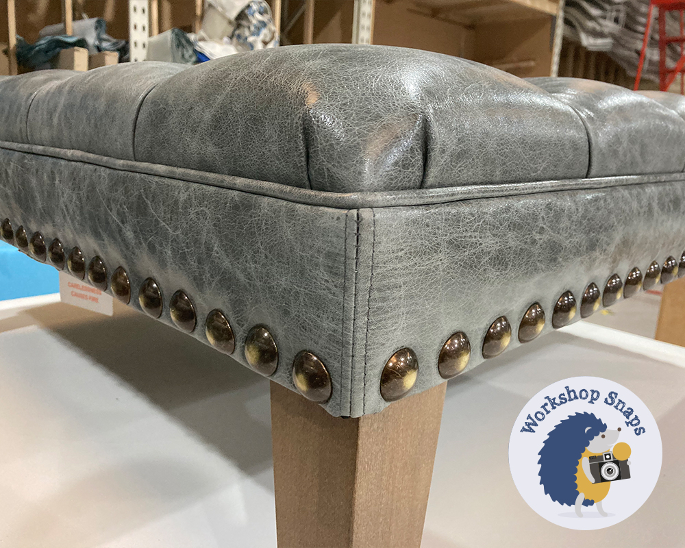 Large square grey leather footstool with buttons