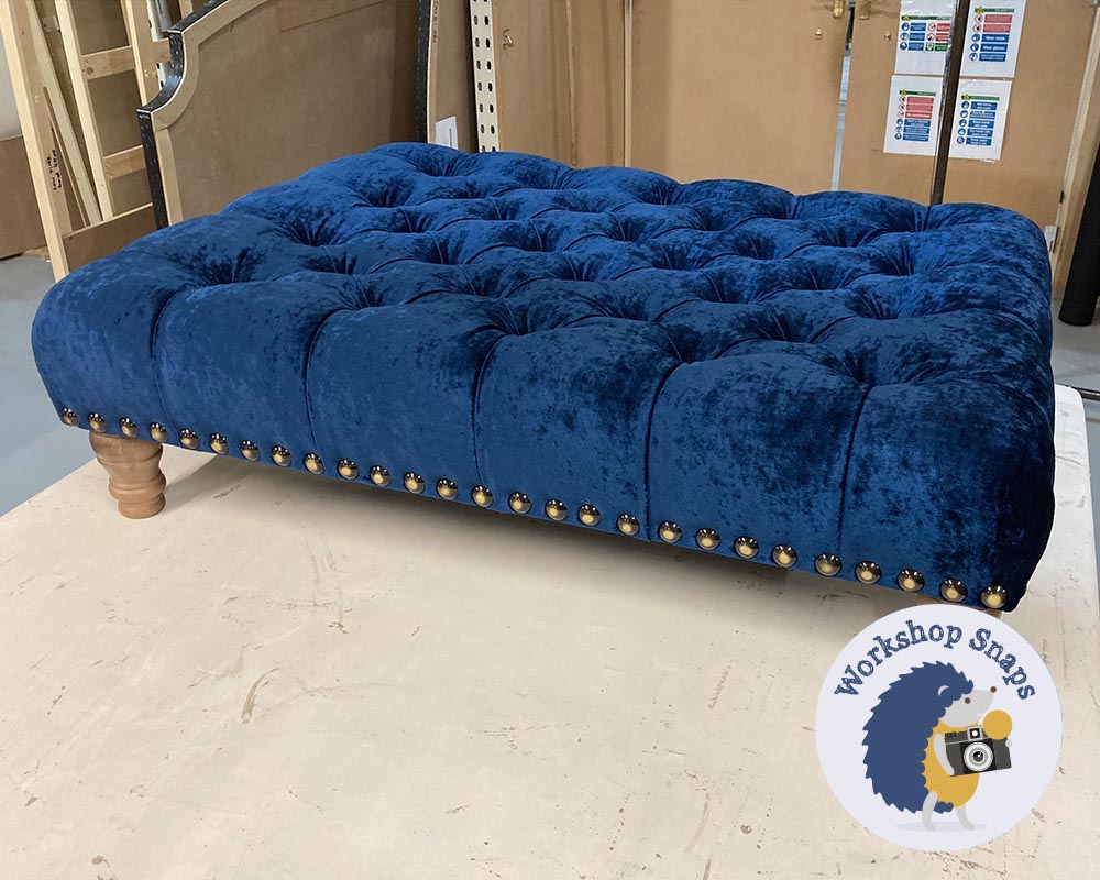 Large rectangle blue crushed velvet padded footstool with buttons and stud edge