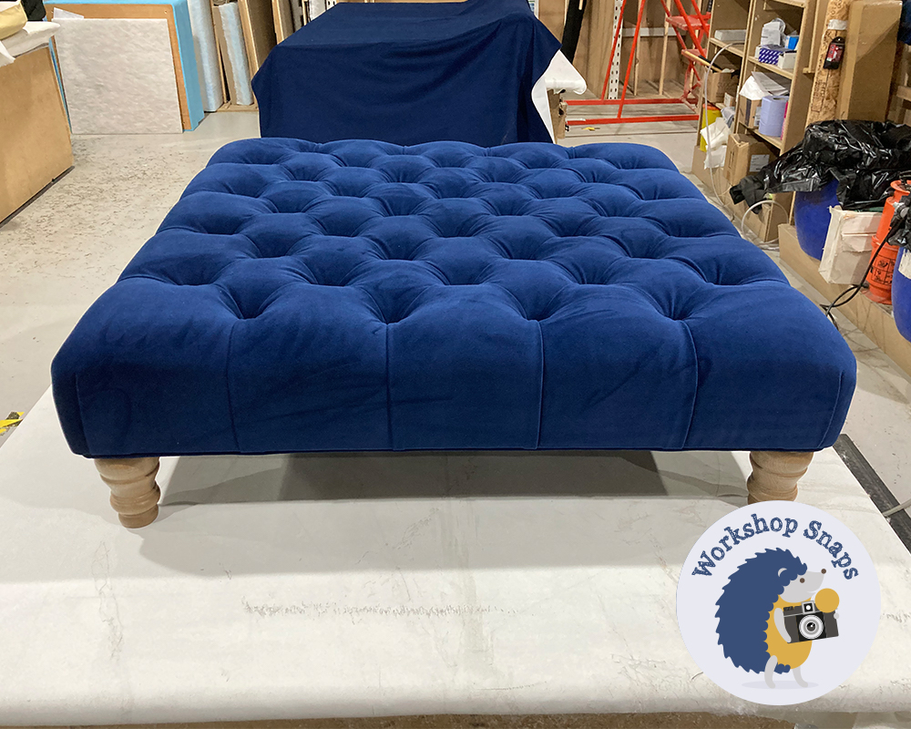 Large square blue velvet fabric footstool with buttons